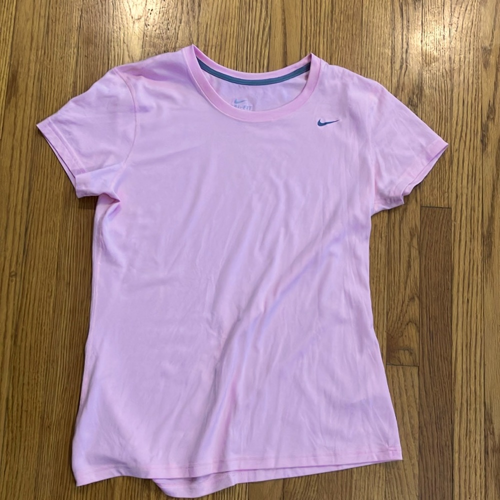 Pink women’s Nike dry fit training top.